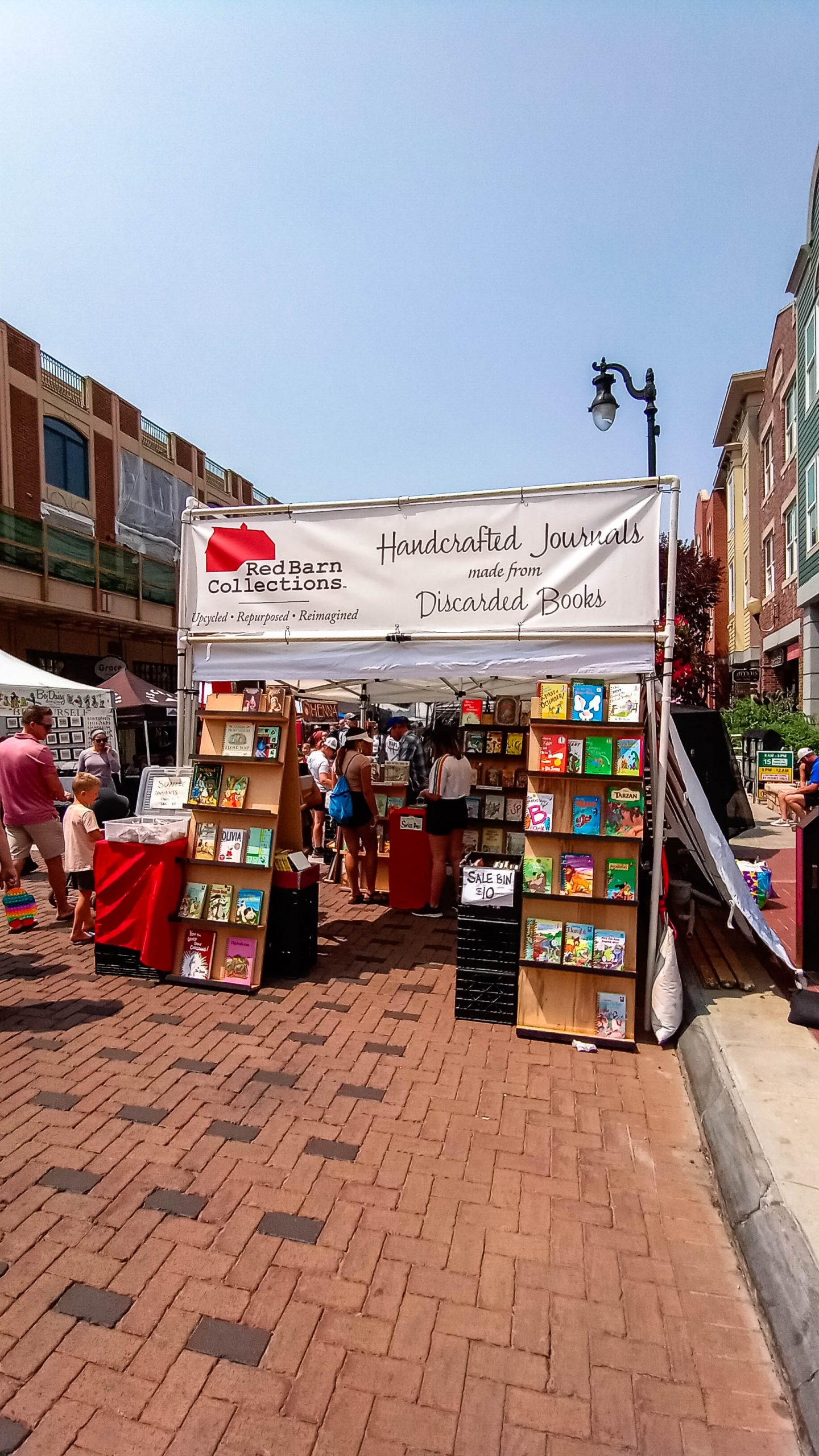 Handcrafted journals, books, and other goods on display.